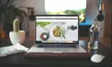 laptop sitting on a table with a website.