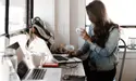 Woman Reading Tablet While Drinking Coffee -- Image by Andrew Neel